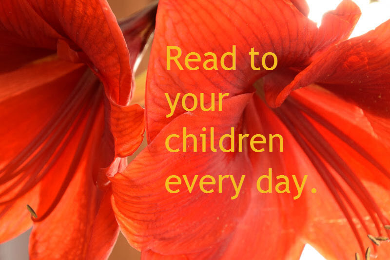 Text: Read to your Children Every Day with red flowers in the background.