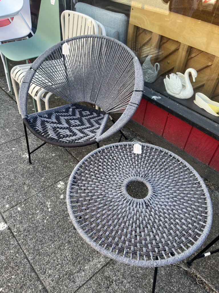 Woven Acapulco chair. Round woven chair and matching woven table.